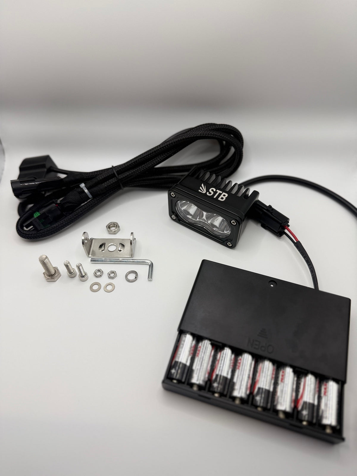 Light pod, wiring harness and battery pack included in the kit