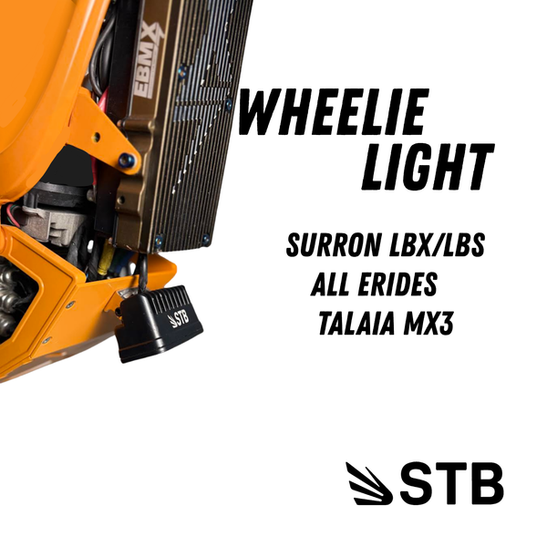 Sur-Ron LBX and E-Ride Pro wheelie light mounted on bike