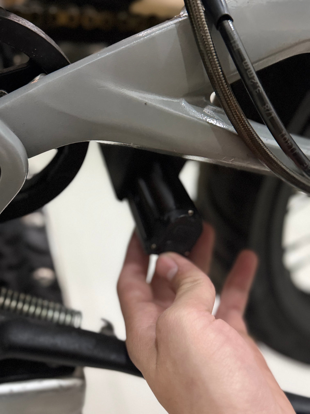 Installing the Talaria X3 Wheelie Light V2 swingarm mount