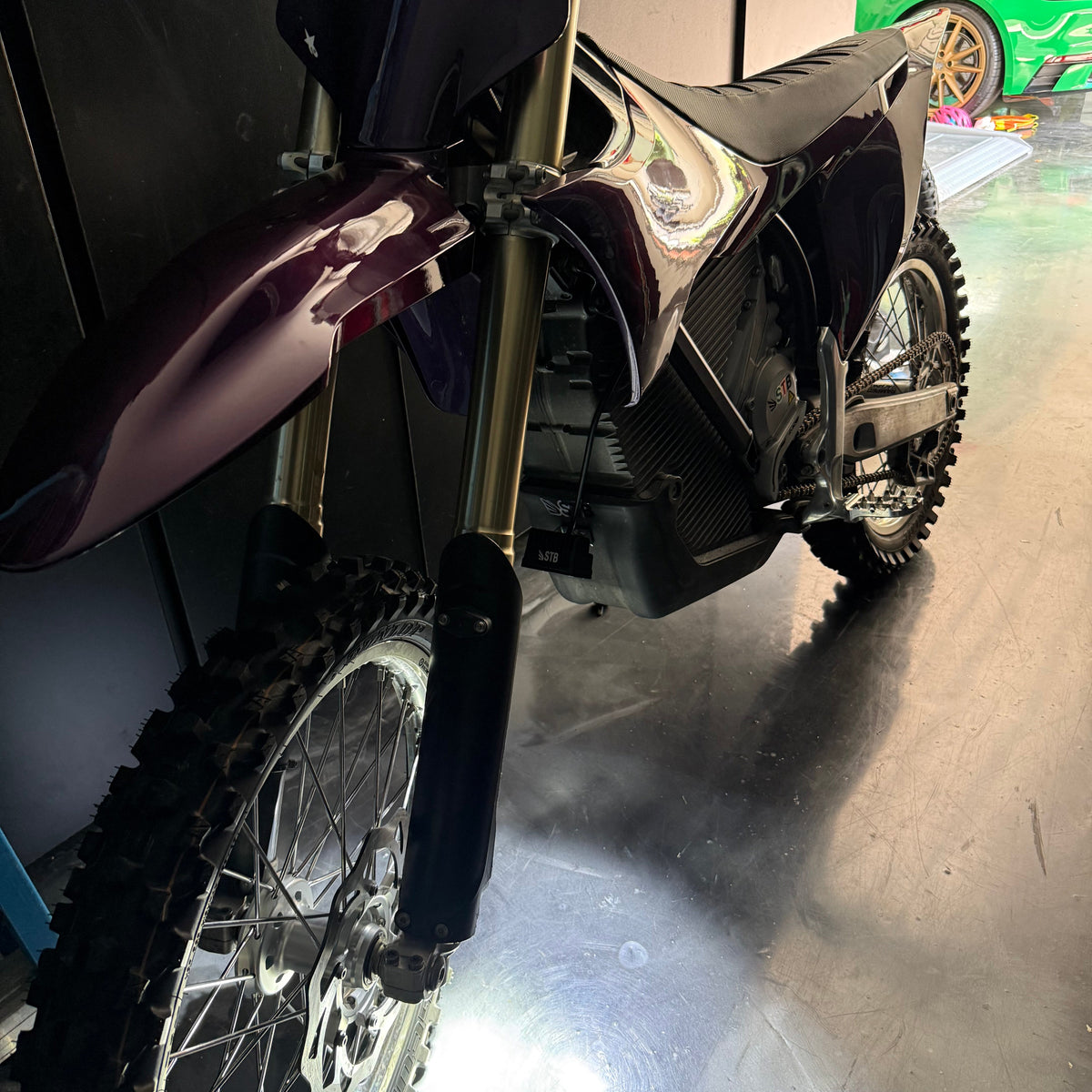 Universal wheelie light installed low on an electric dirt bike
