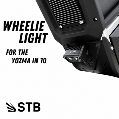Battery powered Yozma wheelie light mounted under the bash guard